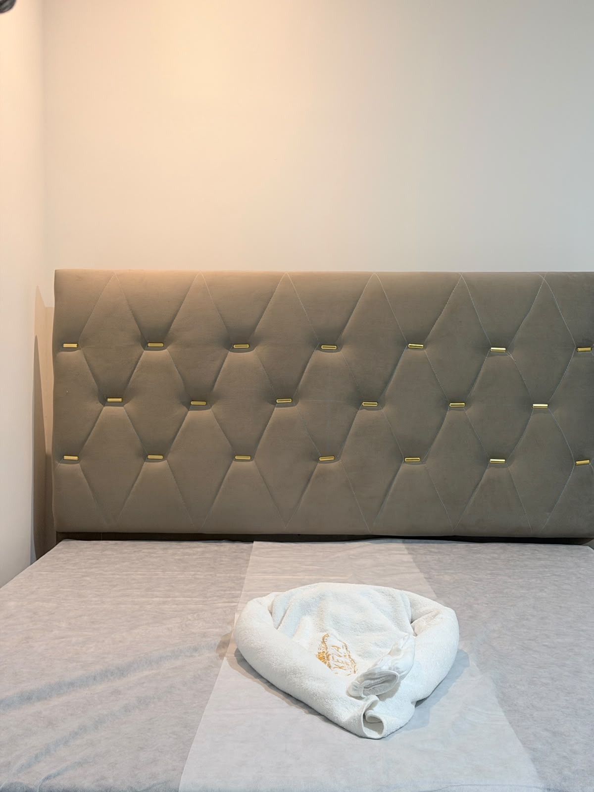 Freshly prepared massage therapy bed with clean linens at KEVA Luxury Spaa, Hennur, Bangalore
